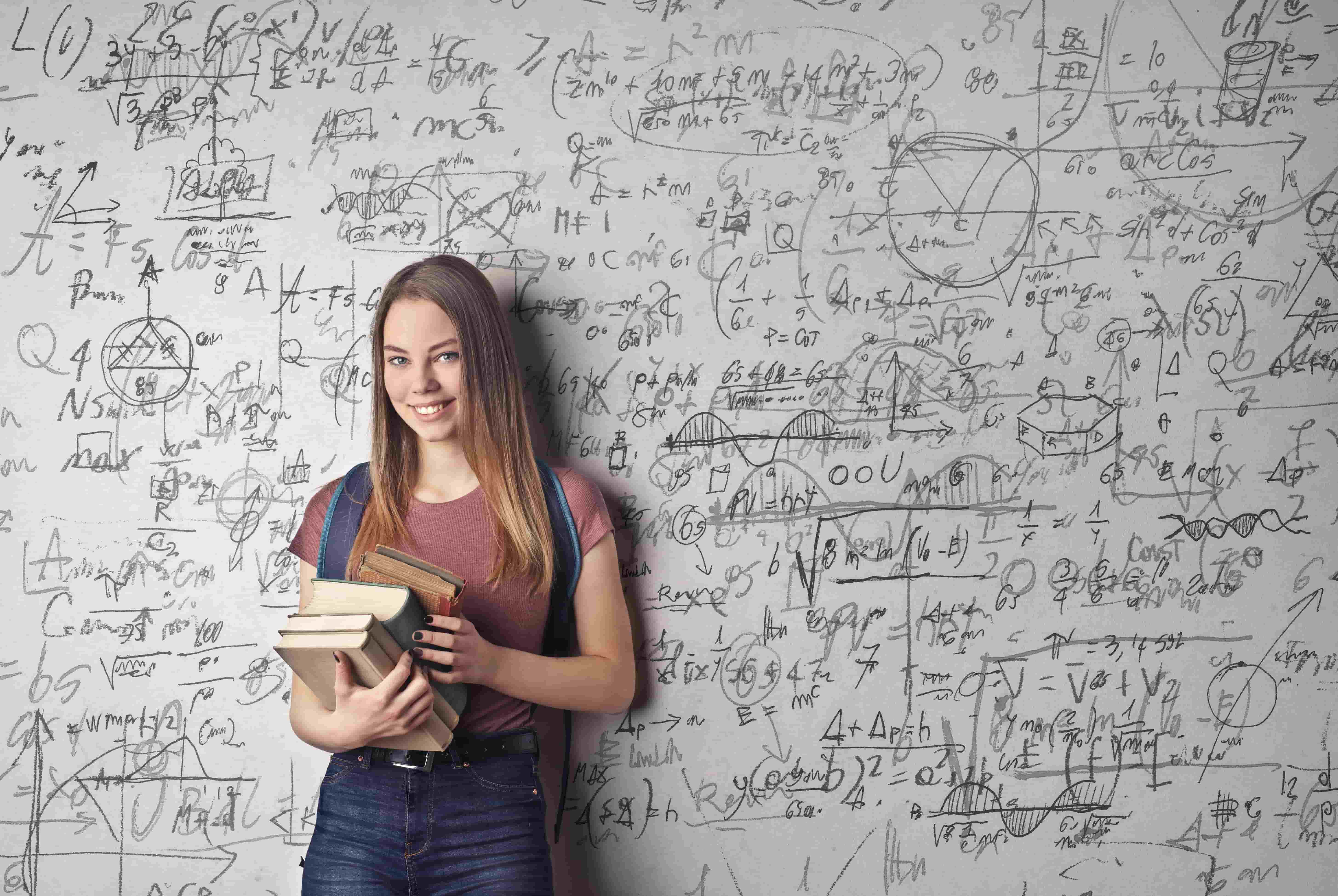 Gifted student standing in front of a whiteboard