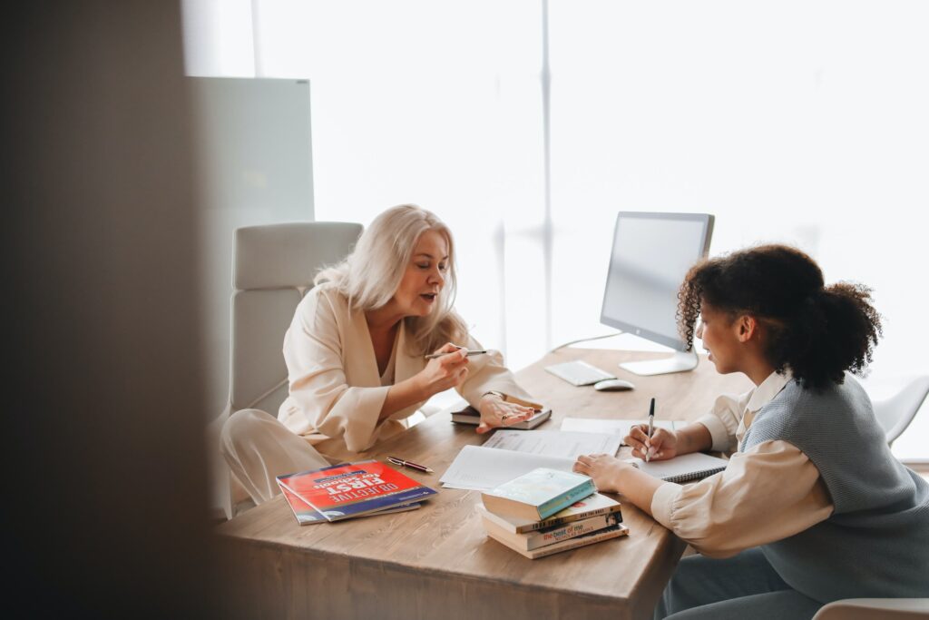 Tutor explains new lesson to her student